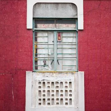 Chinese window on red tile wall Stock Photos