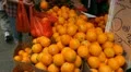 Chinese Woman Shopping Picking Orange Fruits in Hong Kong Market Store Shelves HD Footage