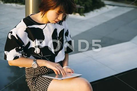 Chinese Woman Using Digital Tablet