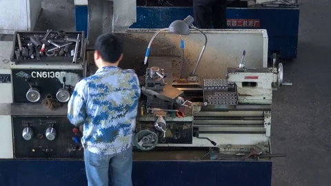 Chinese worker are working on machine tool  in factory Video stock 75847018