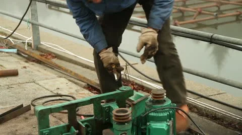 Chinese Worker Repairing A Grinder Stock Footage 8989341