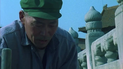 Chinese worker tamps down a stone repairing the Wall of China Stock Footage 78510023