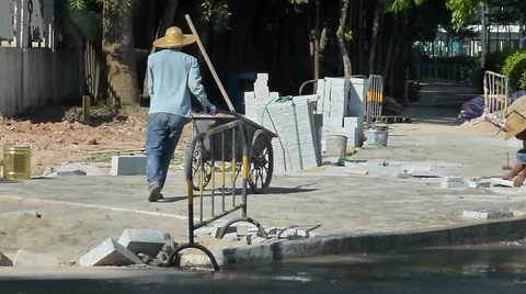 Chinese workers are in the road construction Stock Footage 65390602