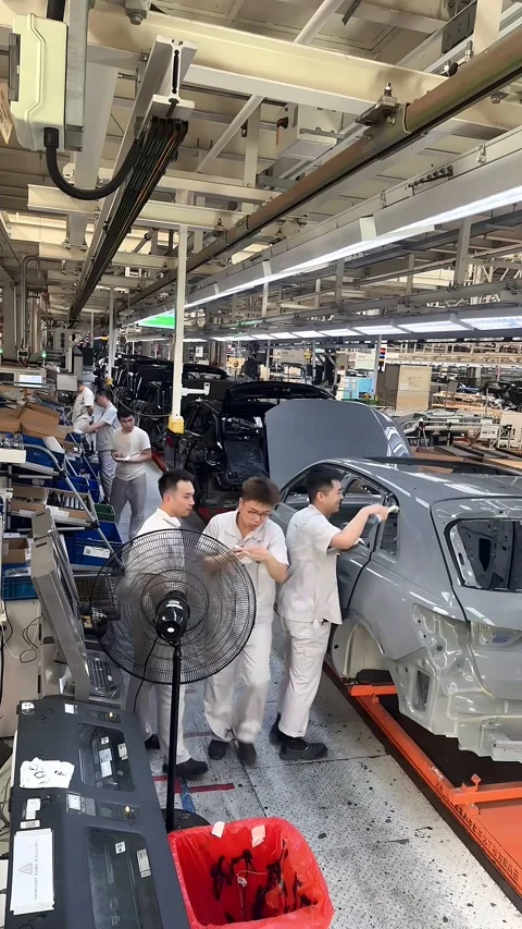 Chinese Workers Assembling New Energy Vehicles in a Modern Factory, China Stock Footage 336824805