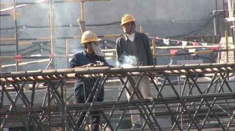 Chinese workers welding on construction site Stock Footage 57374344
