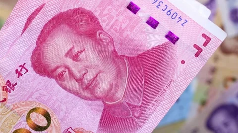 Chinese Yuan (CNY) banknotes falling on cash money background. Stock Footage 309869246