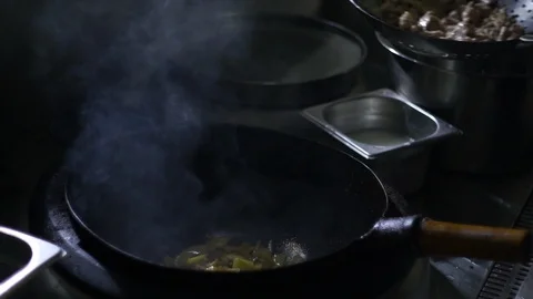 Chinesse food. Working chef preparing chinese food, Food frying in wok pan. 動画素材 117743604