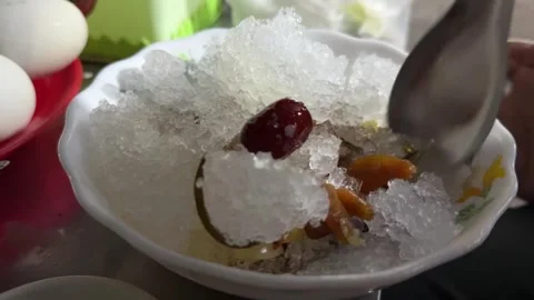 Ching Bo Leung with Shaved Ice Asian Dessert 스톡 동영상 341696006