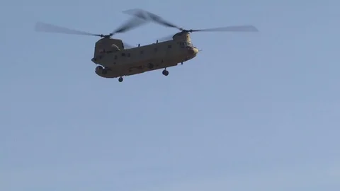 Chinook helicopter parachuting a package 1 Stock Footage 110794530