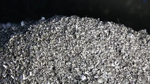 Chip conveyor moving steel chips from coolant tank to the scrap bin Stock Footage 64629378