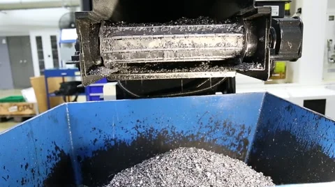 Chip conveyor moving steel chips from coolant tank to the scrap bin Stock Footage 64630677