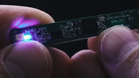 Chip. Hands hold a small chip. Stock Footage 126141664