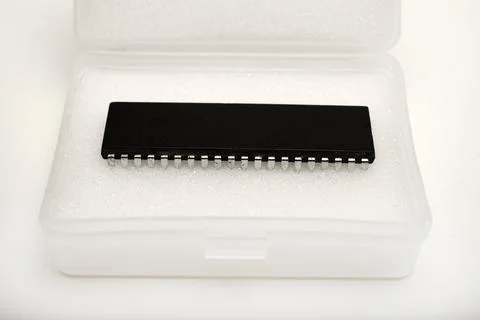 The chip is in a plastic package. An old chip. 스톡 사진