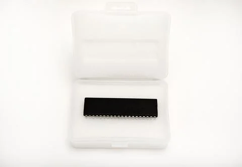 The chip is in a plastic package. An old chip. 스톡 사진