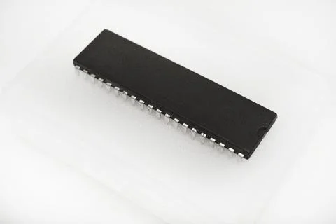 The chip is in a plastic package. An old chip. 스톡 사진