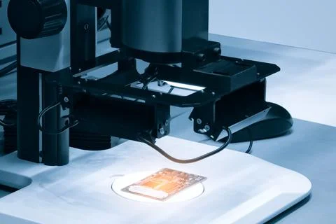 Chip testing equipment. Manufacturing of microchips. A close-up study of a te Stock Photos