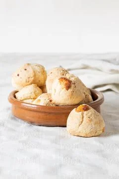 Chipa, typical Paraguayan cheese bread on white tablecloth. Stock Photos
