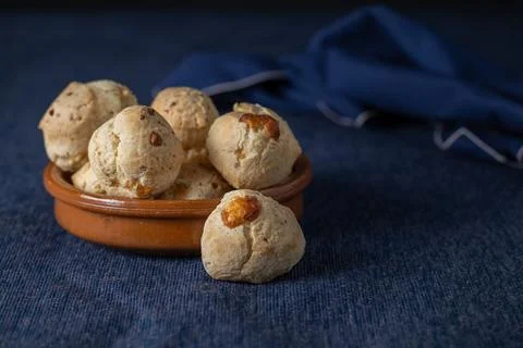 Chipa, typical Paraguayan cheese bread on blue tablecloth with copy space. Stockfoto's