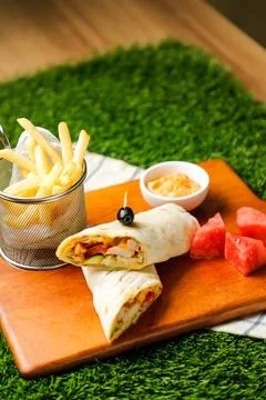 Chipotle Chicken Egg wrap roll filled with tomato, onion, cucumber, cheese .. Foto stock