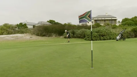 Chipping golf ball close to pin for birdie Video stock 129380086