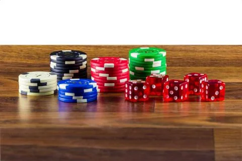 Chips and dice on a table Stock Photos