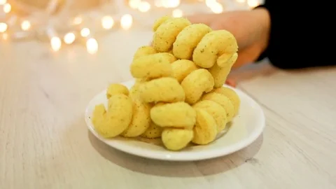 Chips are on the plate medium short. The woman turns the plate. Appetizer in the Stock Footage 85102572