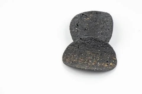 Chips black on white background. Stock Photos