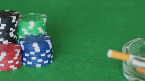 Chips, cards, ashtray on poker table Stock Footage 70210089