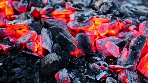 Chips of charcoal in which a fire flares up. Stock Footage 177536381