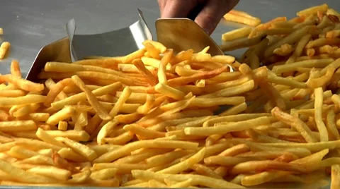 Chips with a chip scoop Stock Footage 8572347