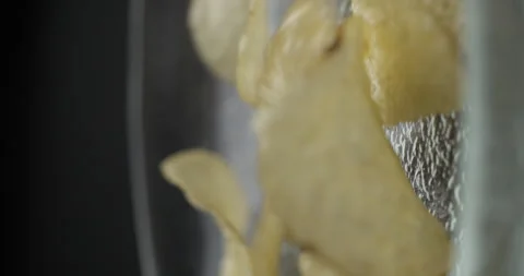 Chips close-up falling in studio 4K vertical view Stock Footage 277001965