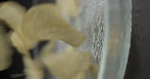 Chips close-up falling in studio 4K vertical view Stock-Footage 277001993