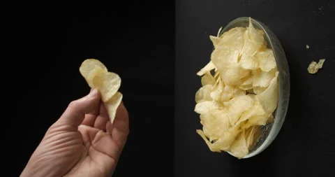 Chips close-up picking in studio 4K vertical view Stock-Footage 277003051