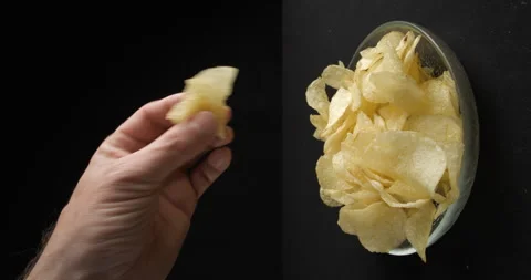 Chips close-up picking in studio 4K vertical view Stock-Footage 277003187