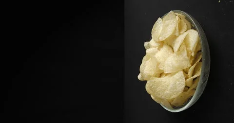 Chips close-up picking in studio 4K vertical view Stock-Footage 277003540