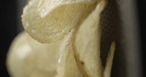 Chips close-up rotating in studio 4K vertical view Stock Footage 277003878