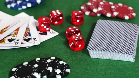 Chips, deck of cards and dice on table Stock Footage 70376136