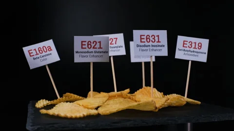 Chips displaying harmful ingredients rotating Stockbeeldmateriaal 347768839