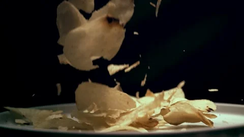 Chips Fall on a Dinner Plate Stock Footage 300889850