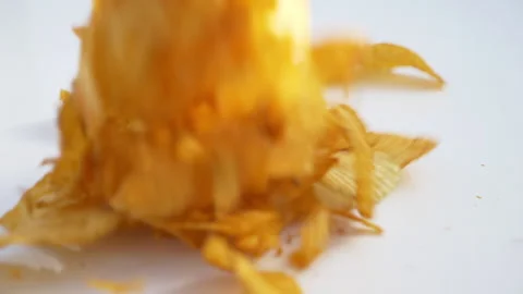 Chips falling in black bowl Stock Footage 139812866