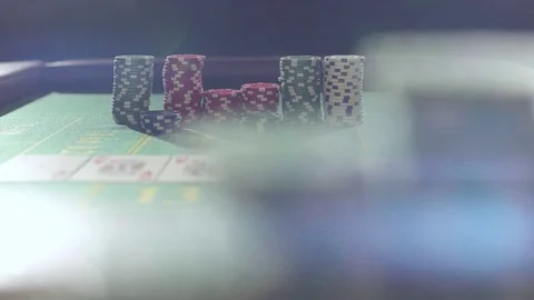 Chips falling on a green table in casino Video stock 72472566