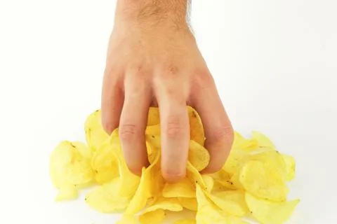 Chips in hand on the white background Stock Photos