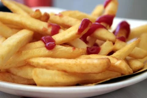 Chips with ketchup Stock Photos