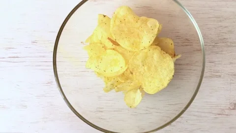 Chips in a large transparent plate. fried potato. Stock Footage 134705725