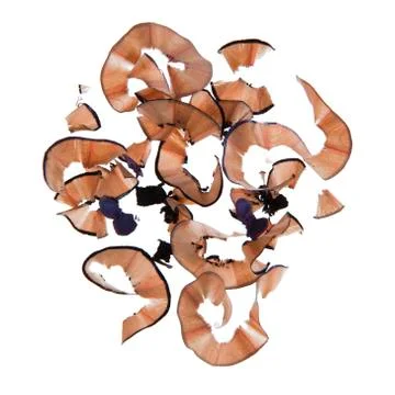 Chips left over sharpening pencil on white background forming abstract pattern Foto stock