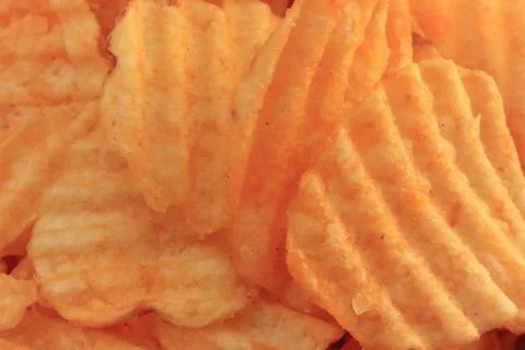 Chips macro closeup background. Fried potato recipe. Snack. Food Foto stock