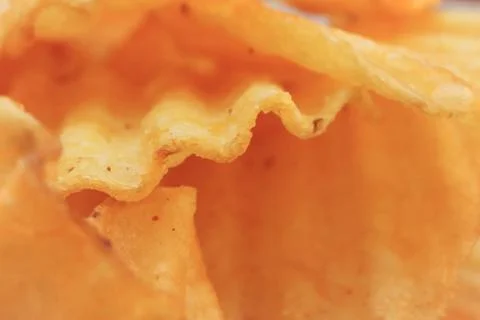 Chips macro closeup background. Fried potato recipe. Snack. Food Foto stock