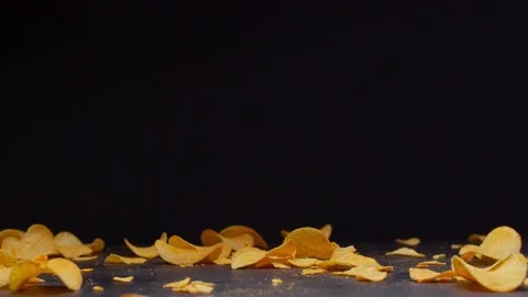 Chips, many chips fall on the table, pringles, food porn , 120fps 2.6k Stock Footage 130800103