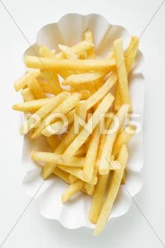 Chips in paper dish (overhead view) Stock Photos