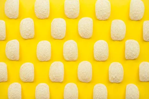 Chips pattern on a bright yellow background. Weight loss and diet concept. Stock Photos